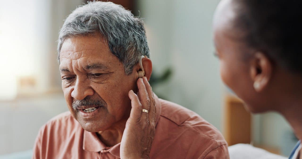 Man at doctor with hearing loss